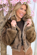 Wrapped in fluffy jacket - Camel